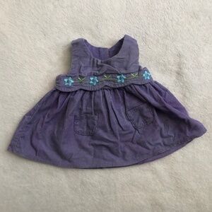 American Girl Doll purple dress with flowers.